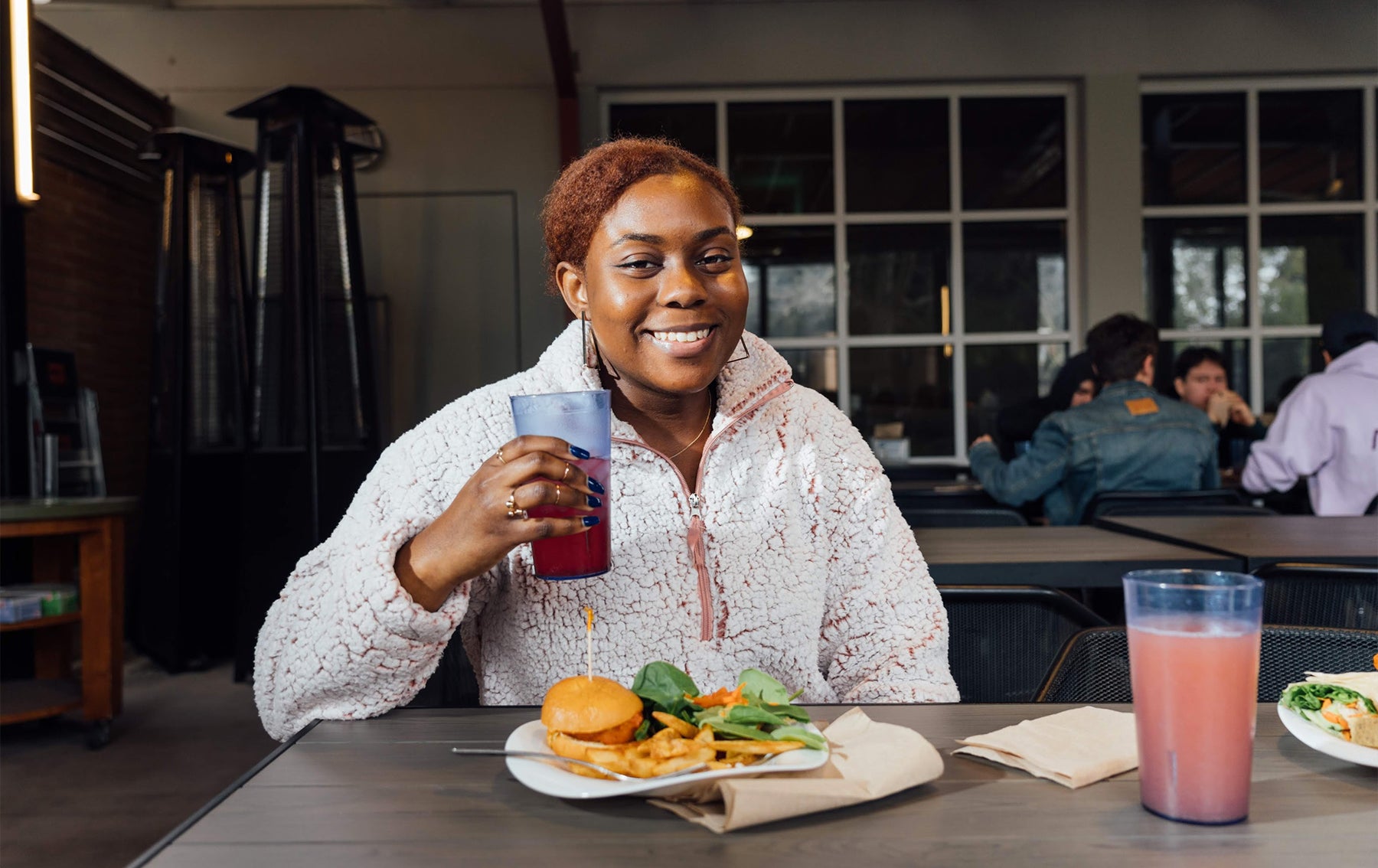 Student enjoying a meal at Lothian