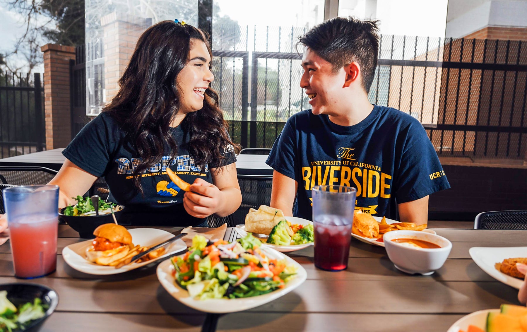 Students laughing during their meal at Lothian