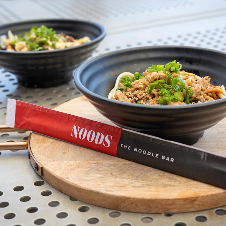 NOODS branded chopsticks with noodle bowls