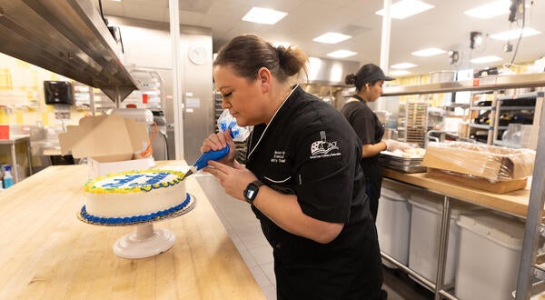 Bakers decorate cakes