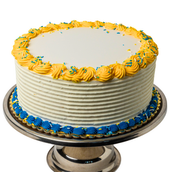 white cake with ucr-colored piping