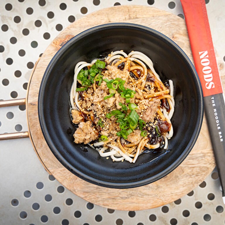 Bowl of noodles with NOODS Chopsticks