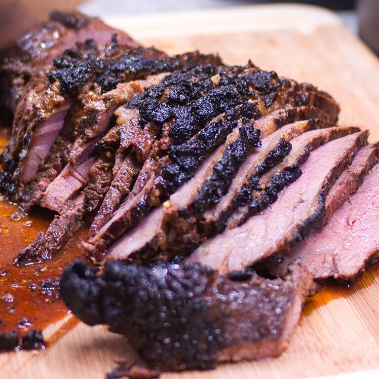 tri tip being cut
