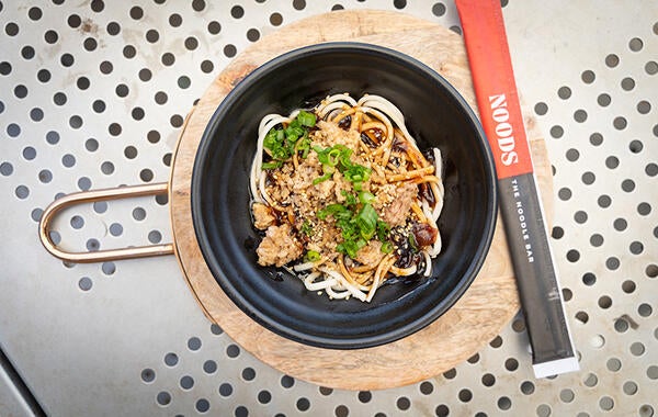 Bowl of noodles with NOODS Chopsticks