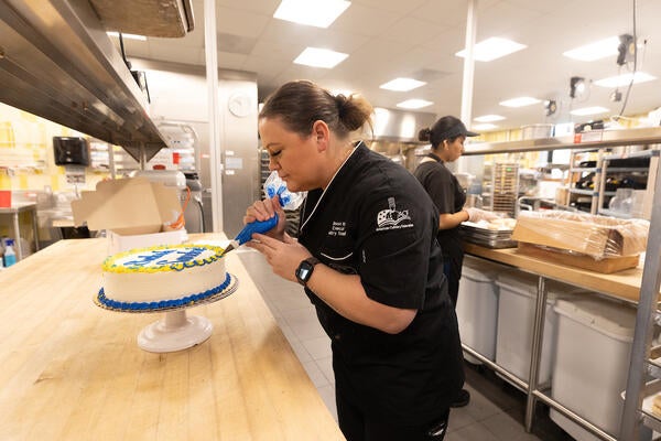 Bakers decorate cakes