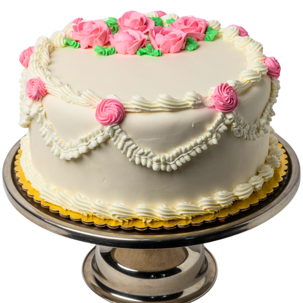 white cake with pink flowers