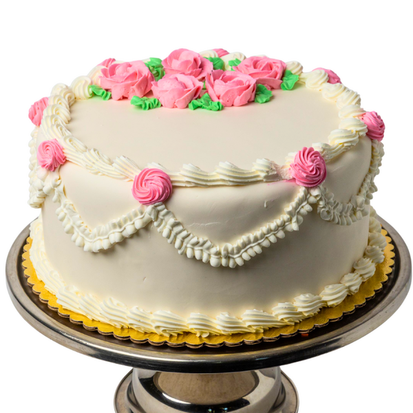 white cake with pink flowers