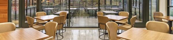 The stable indoors with empty chairs and tables