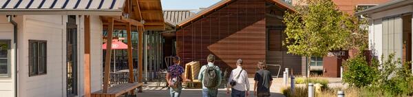 A group walking outside The Stable