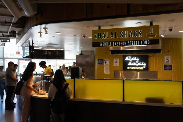student ordering food at Halal Shack