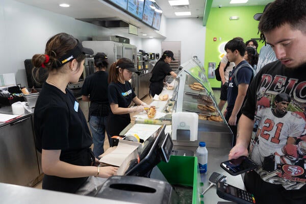 students ordering at Subway