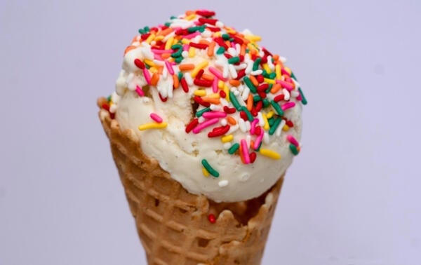 one scoop ice cream cone with sprinkles