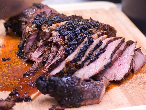 tri tip being cut