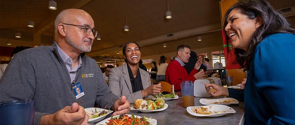 Staff Talking and Dining