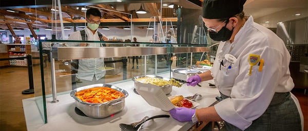 Staff Serving a Student at the Barn