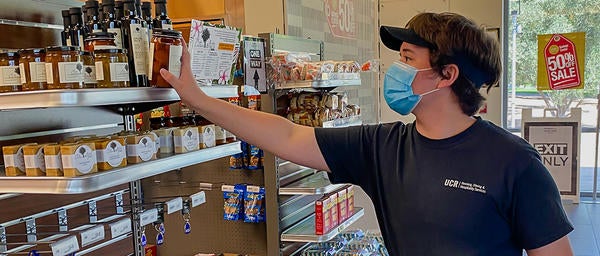 Dining Student Staff Stocking Shelves at SHOP