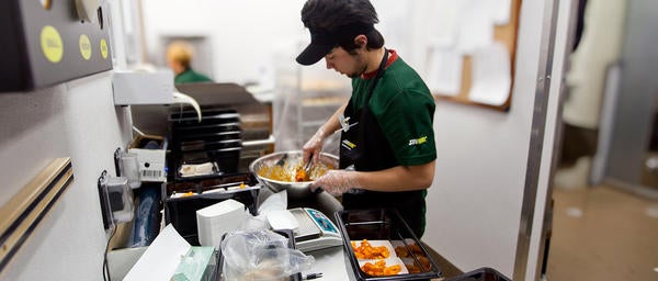 Student Making Food at Subway