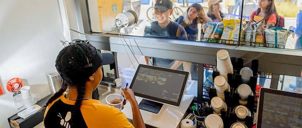 Student Taking a Drink Order at Emerbee's