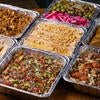 Aluminum trays of food from Scottys Grill and Market.