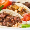 Catering Services plate with three street tacos and fresh vegetables