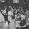 A black and white photo of diners in the Barn.