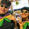 Student workers dressed up for Mardi Gras.